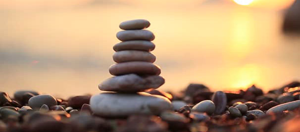 peaceful sunshine on a pond with stones